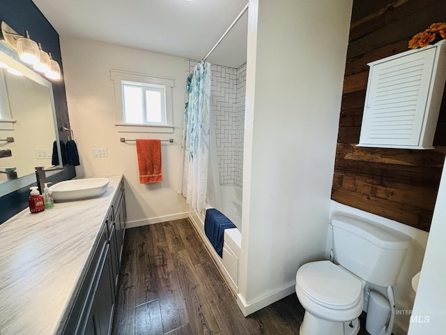 802 S 9th St, Rupert, ID 83350 - full bathroom with toilet, vanity, wood finished floors, and shower / bath combo with shower curtain