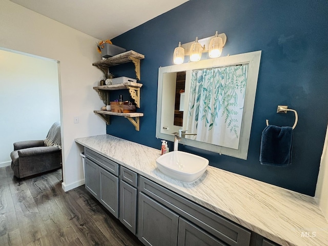 802 S 9th St, Rupert, ID 83350 - bathroom featuring wood finished floors, vanity, and baseboards