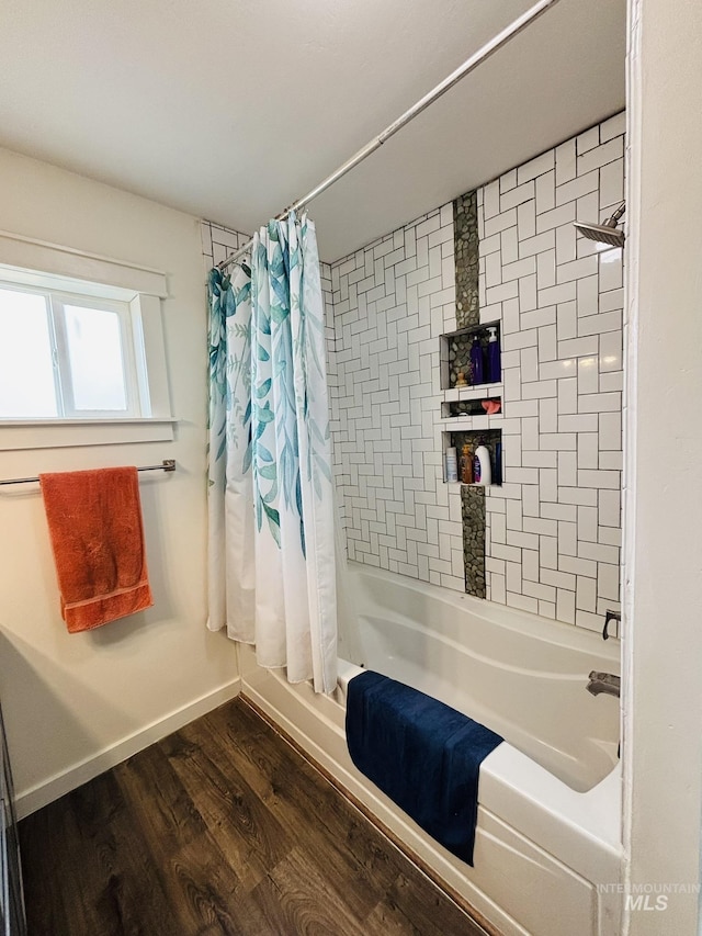 802 S 9th St, Rupert, ID 83350 - bathroom with shower / bath combination with curtain, wood finished floors, and baseboards