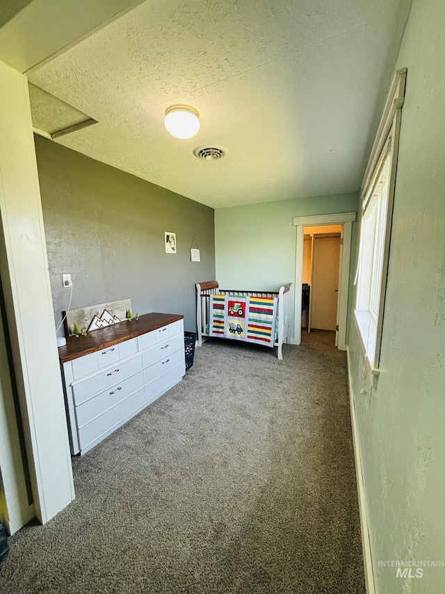 802 S 9th St, Rupert, ID 83350 - carpeted bedroom featuring a textured ceiling