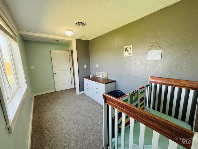 802 S 9th St, Rupert, ID 83350 - carpeted bedroom with a textured wall and baseboards