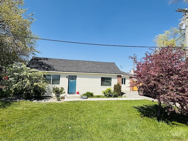 802 S 9th St, Rupert, ID 83350 - view of front facade featuring a front yard and a shingled roof