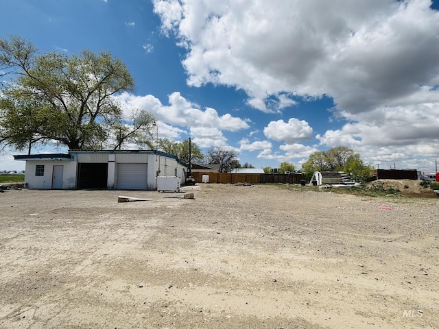 802 S 9th St, Rupert, ID 83350 - view of yard with a detached garage and an outbuilding