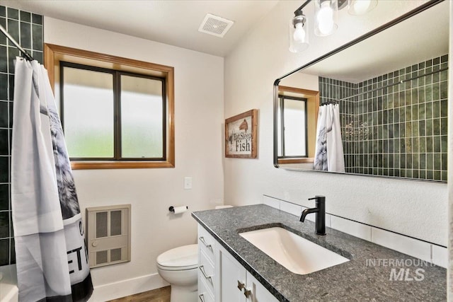 76 W Castle Creek Rd, Garden Valley, ID 83622 - bathroom with vanity, toilet, a shower with shower curtain, and baseboards
