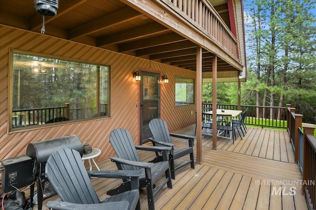 76 W Castle Creek Rd, Garden Valley, ID 83622 - wooden deck with outdoor dining space