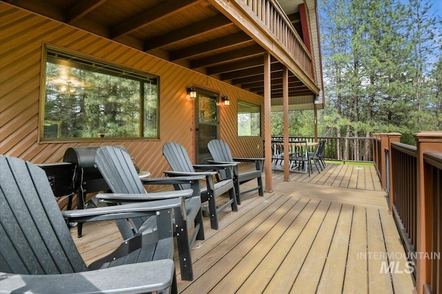 76 W Castle Creek Rd, Garden Valley, ID 83622 - wooden deck with outdoor dining area