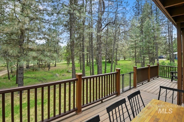 76 W Castle Creek Rd, Garden Valley, ID 83622 - wooden terrace featuring a lawn and view of scattered trees