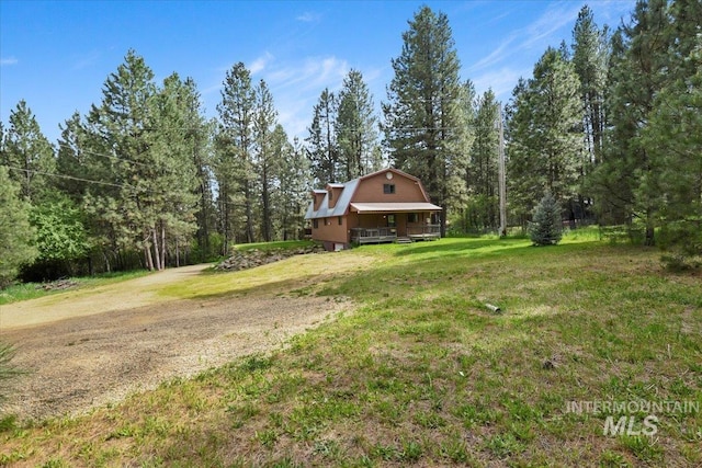 76 W Castle Creek Rd, Garden Valley, ID 83622 - view of grassy yard featuring a porch