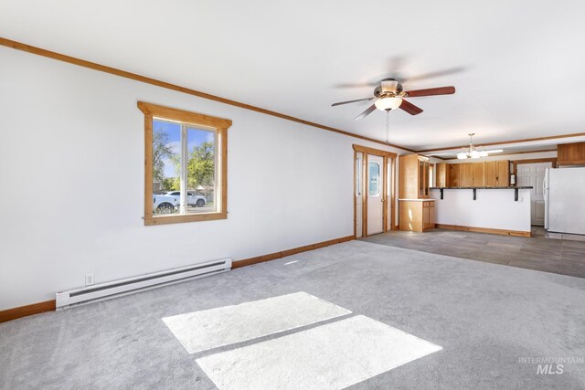 unfurnished living room with baseboard heating, baseboards, light colored carpet, and ceiling fan with notable chandelier