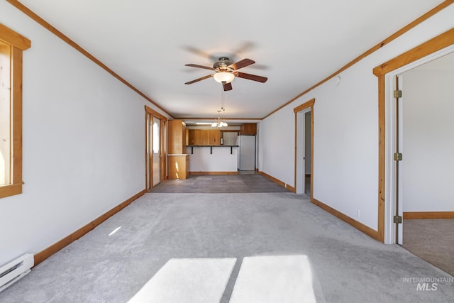 unfurnished living room with ornamental molding, carpet floors, baseboards, baseboard heating, and ceiling fan
