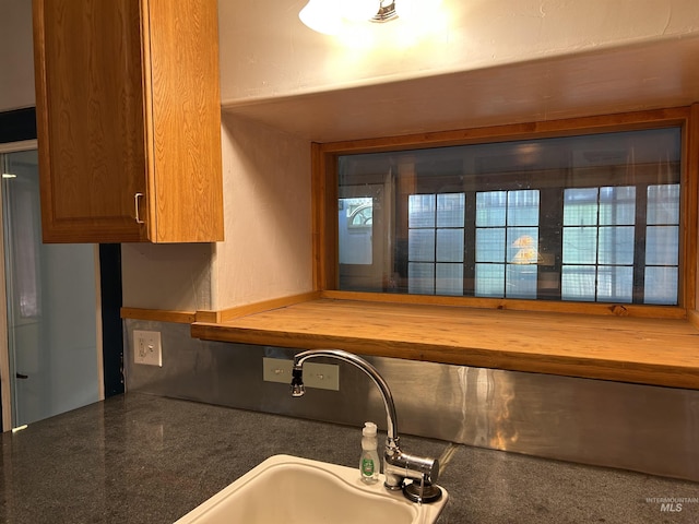 kitchen featuring wood counters and sink