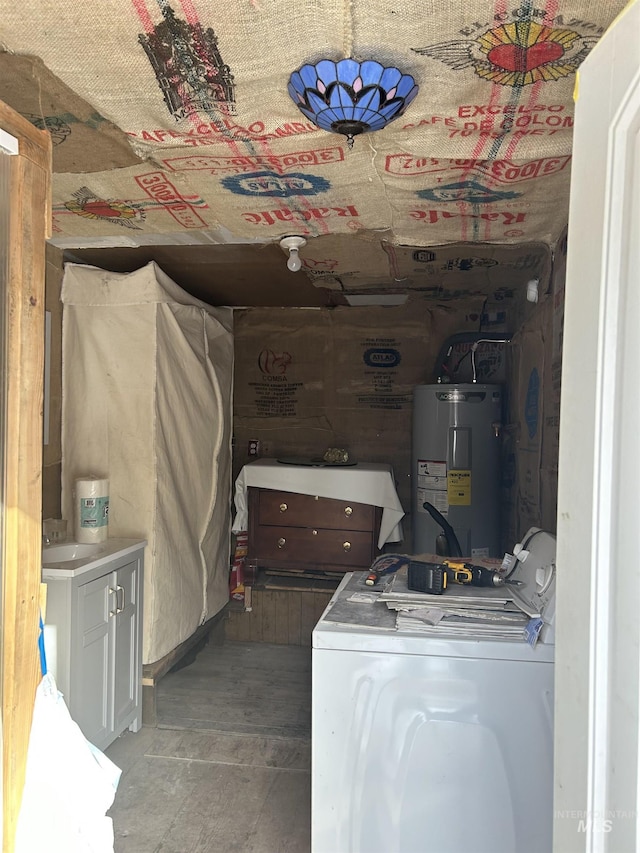 bathroom featuring separate washer and dryer and electric water heater