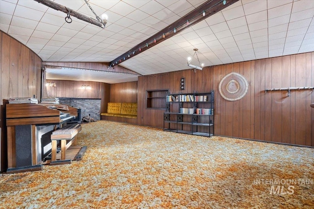 carpeted office with wood walls