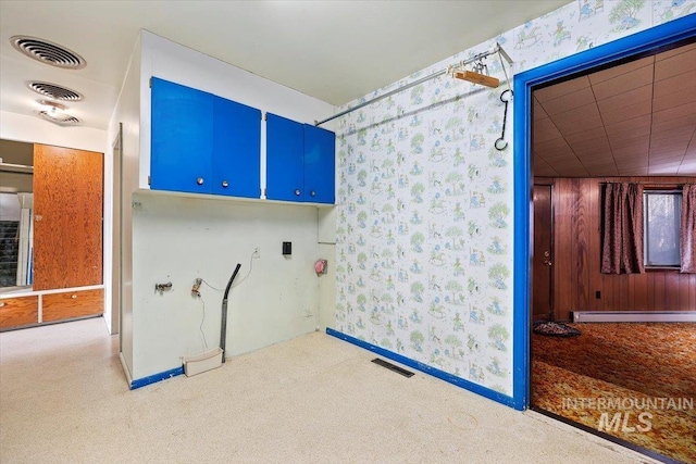 clothes washing area featuring baseboard heating, carpet flooring, visible vents, and baseboards