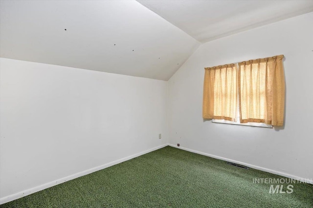 additional living space featuring lofted ceiling, carpet, visible vents, and baseboards