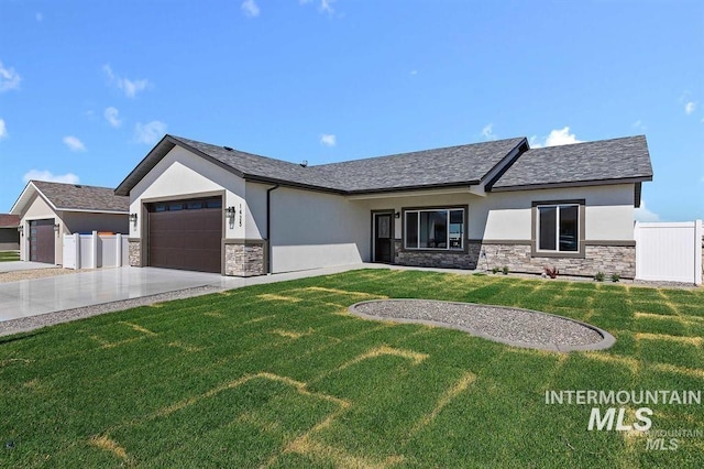 view of front facade with a garage and a front lawn