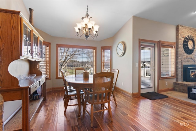520 9th St, Middleton, ID 83644 - dining space with baseboards, wood finished floors, and a notable chandelier