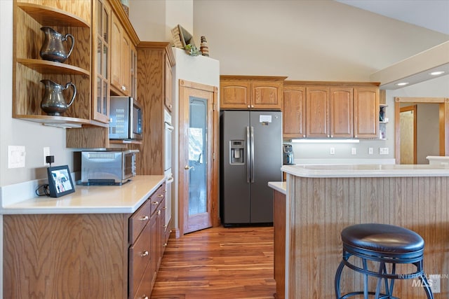 520 9th St, Middleton, ID 83644 - kitchen featuring open shelves, light countertops, a kitchen breakfast bar, and stainless steel appliances