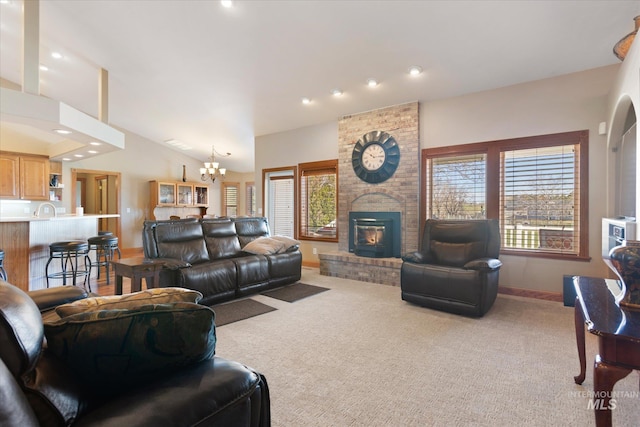 520 9th St, Middleton, ID 83644 - living room with a notable chandelier, a healthy amount of sunlight, carpet, and a brick fireplace