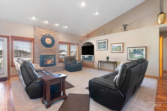 520 9th St, Middleton, ID 83644 - living area featuring baseboards, high vaulted ceiling, light wood-style floors, and a brick fireplace