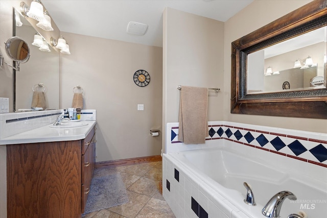 520 9th St, Middleton, ID 83644 - full bathroom featuring tile patterned floors, vanity, baseboards, and a bath