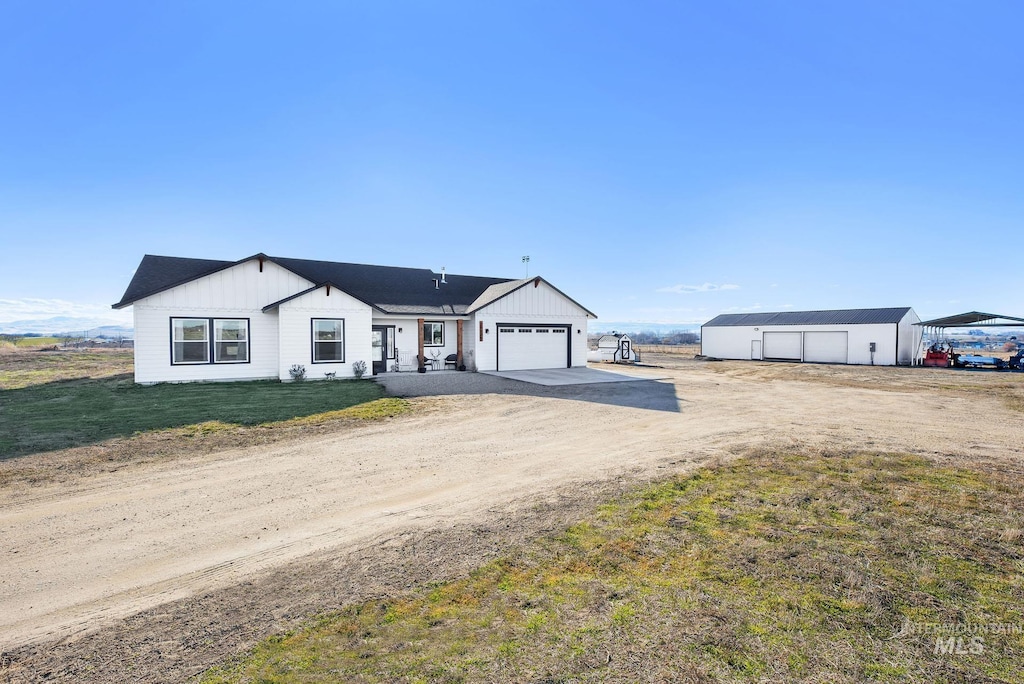 view of front of property with a carport and a front lawn