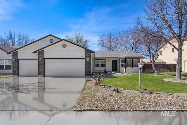 653 S Tennyson Way, Boise, ID 83709 - single story home with a garage, driveway, brick siding, and roof with shingles
