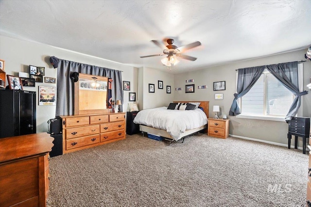 705 H St, Rupert, ID 83350 - bedroom with baseboards, ceiling fan, and carpet