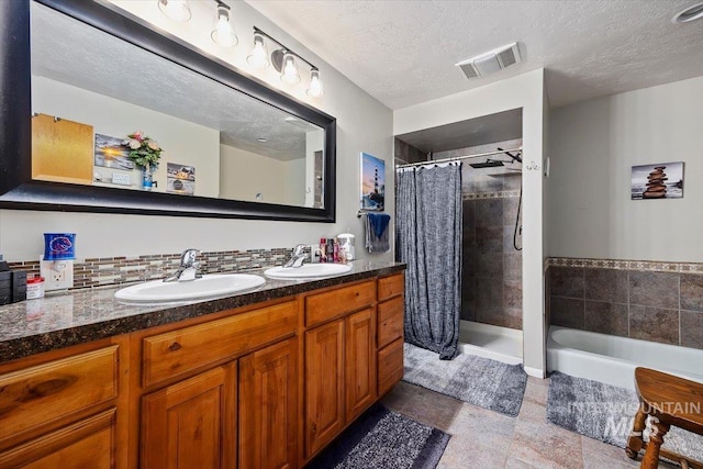 705 H St, Rupert, ID 83350 - full bathroom with tiled shower, visible vents, and a sink