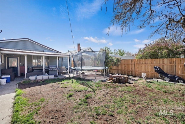 705 H St, Rupert, ID 83350 - view of yard featuring fence and a trampoline