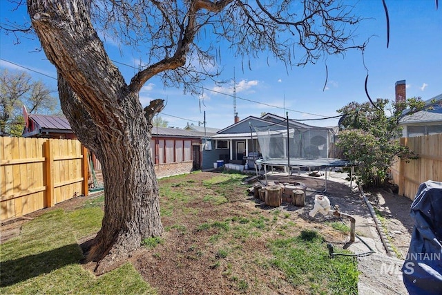 705 H St, Rupert, ID 83350 - view of yard with a trampoline and a fenced backyard