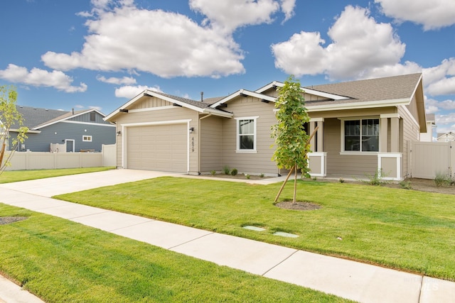 view of front of property with a garage and a front lawn