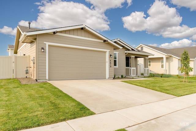 view of front facade featuring a garage and a front lawn