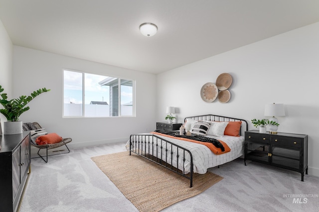 bedroom with baseboards and carpet flooring