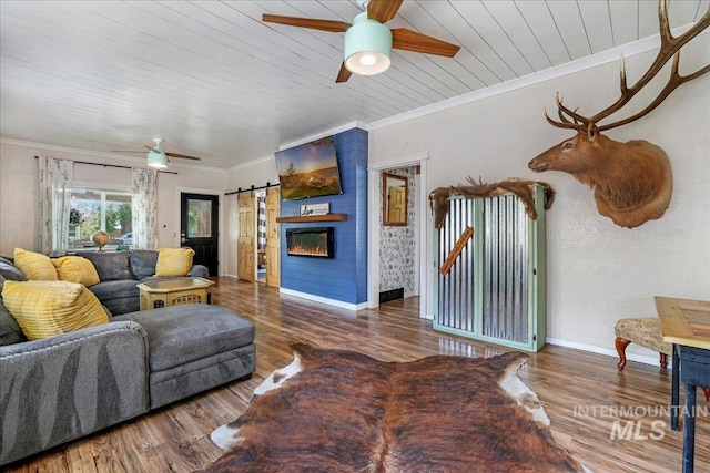 353 7th Ave E, Twin Falls, ID 83301 - living area featuring a ceiling fan, a barn door, wood ceiling, baseboards, and wood finished floors