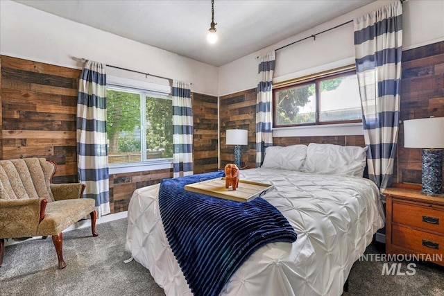 353 7th Ave E, Twin Falls, ID 83301 - bedroom featuring carpet floors, multiple windows, and wood walls