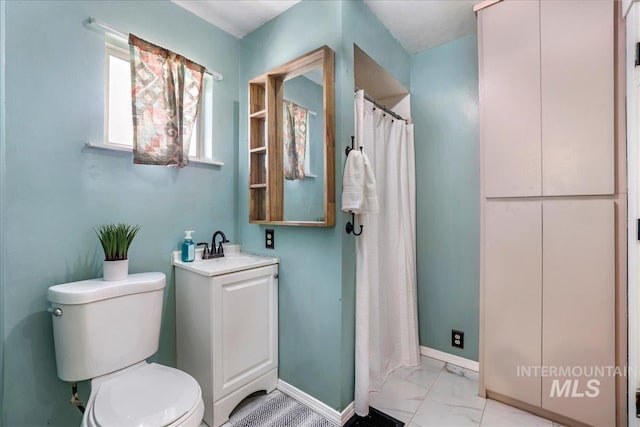 353 7th Ave E, Twin Falls, ID 83301 - full bath featuring toilet, marble finish flooring, baseboards, vanity, and a shower with shower curtain