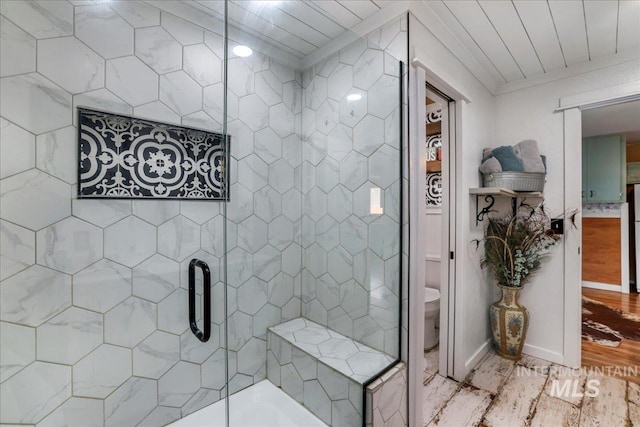 353 7th Ave E, Twin Falls, ID 83301 - bathroom featuring wood finished floors, a stall shower, toilet, and ornamental molding