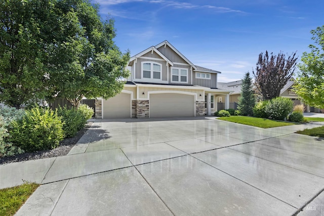 craftsman-style house with a front yard and a garage