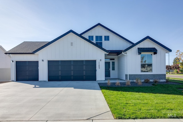 modern farmhouse style home featuring a garage, driveway, a shingled roof, and board and batten siding