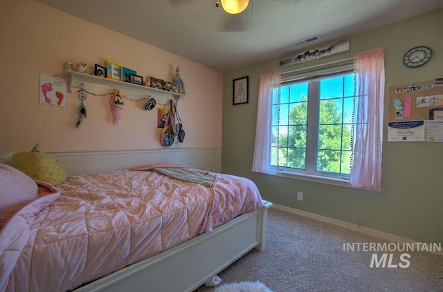 bedroom with ceiling fan and carpet