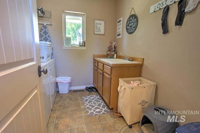 bathroom with tile patterned flooring and vanity