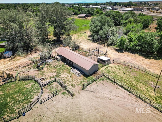 birds eye view of property featuring a rural view