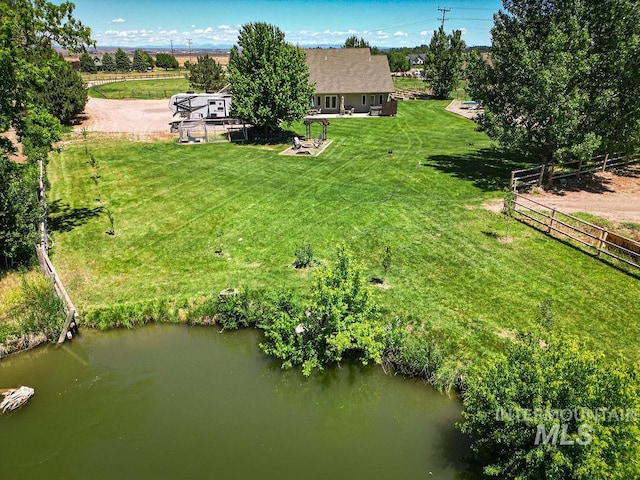 birds eye view of property with a water view