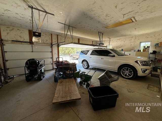 garage featuring a garage door opener