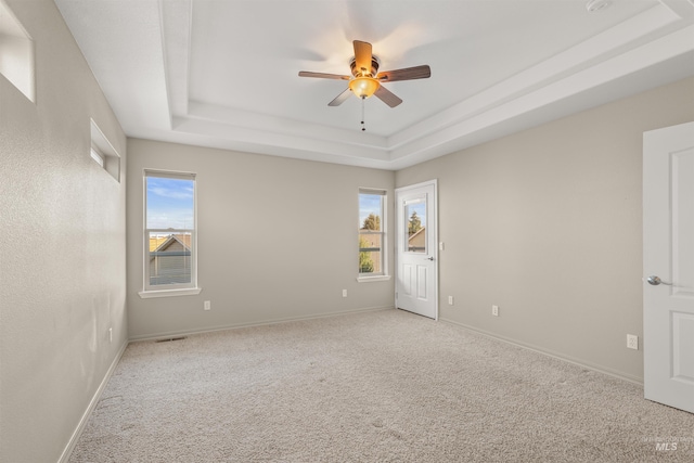 3017 Cypress St, Lewiston, ID 83501 - unfurnished room with a raised ceiling, plenty of natural light, ceiling fan, and carpet