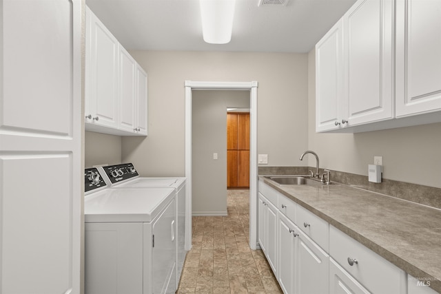 3017 Cypress St, Lewiston, ID 83501 - laundry area with cabinet space, washing machine and dryer, and baseboards