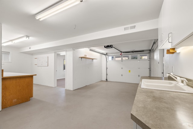 3017 Cypress St, Lewiston, ID 83501 - garage with a sink and a garage door opener