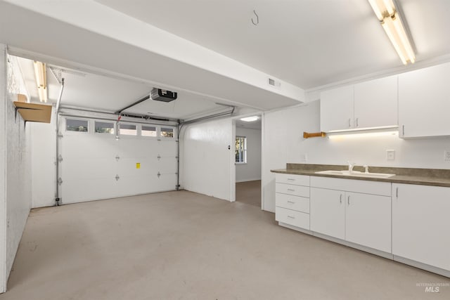 3017 Cypress St, Lewiston, ID 83501 - garage featuring a sink and a garage door opener