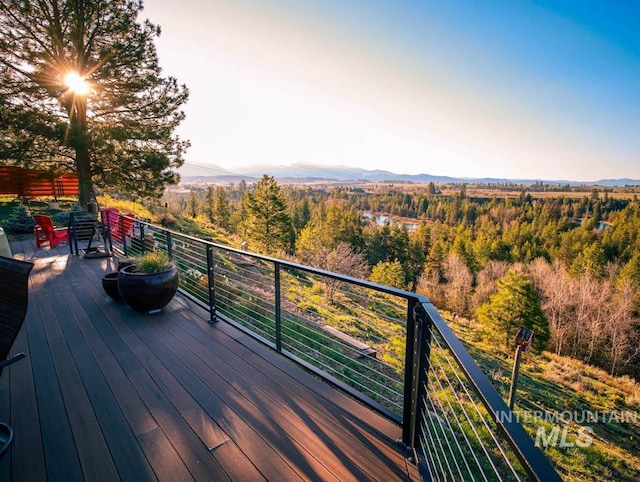 986 Valley Rim Rd, Mccall, ID 83638 - deck featuring a mountain view and a forest view